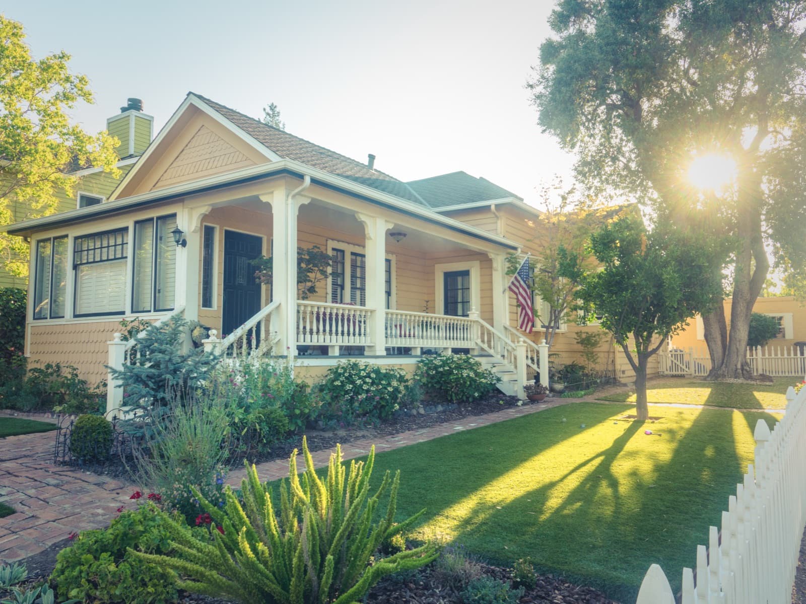 Classic porch house in warm sun.
